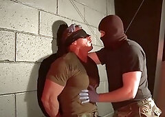 Muscular jock Derek Pain endures a grueling interrogation by Master Dire Callahan