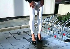 Pissing in white sexy leggings