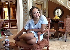 Curly amateur gives a footjob