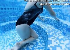 Lascivious mother I'd like to fuck masturbates crossed legs to climax in a public pool.