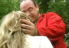 Great looking blonde lets a stranger touch her pussy and sucks his cock, in the forest