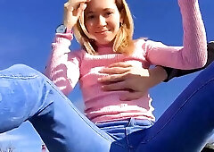 Charming blonde chick is about to be naughty on the beach, in the middle of the day