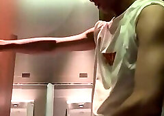 Young man masturbates in public toilet and seduces stranger