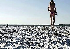 Strolling on the Beach in a sexy bikini