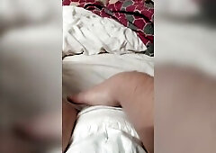 Samantha playing with her diaper