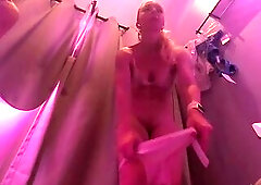 In a public fitting room, a undressed cutie with a soaked booty tries on pants and underclothing. Caught mastu