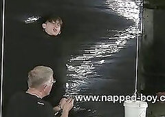 Twink bound in pallet wrap gets stroked