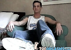 Young feet worshiper strokes his cock and cums on his feet