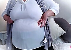 Aunty teasing with a scarf, showcasing her big natural tits and mature charm