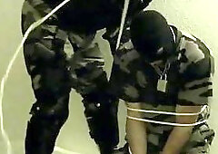 Soldiers playing with gun & spanking