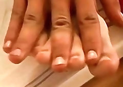 Twink plays with his bare feet and jerks off solo