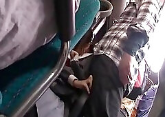 A horny man is putting his fingers in a young Japanese babe’s panties, while in the bus