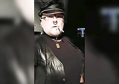 Headmistress LeatherBikerGena aka Mistresse GenaJuggzz dangling a Red with unfathomable inhales and no ashing.