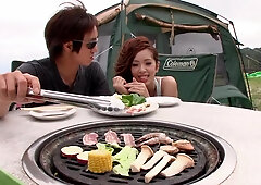 Asian couple having some freaky outdoor sex