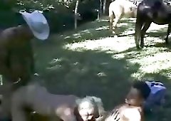 Two cowboys share one Tgirl