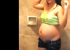 Pregnant submissive fed by her partner while the third watches in the red room