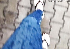a crossdresser with gorgeous feet walks the street in hot flip flops