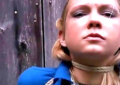 Hot blonde roped to a wood fence begs mercy BDSM