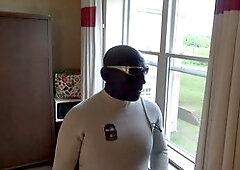 Wet and wild wetsuit action in a motel room