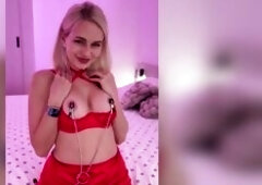 Golden-haired teasing in red underware and nipp clamps