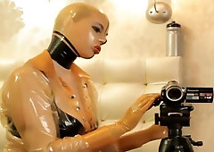 WOMAN PUTS ON LATEX JO-BAG COSTUME