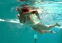 Slender swimmer Alla Zlatavlaska shows a great underwater show