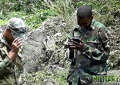 Two military lads resting by the river