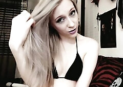 cute golden-haired camgirl brushes her lengthy silvery hair