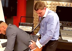 Tattoed pervert with a big cock penetrates a businessman