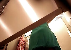 Girl trying on dress in change room gets upskirt spied