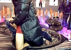 Guy in nylon shorts enjoying handjob on a shiny bed