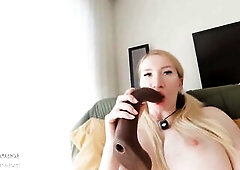 A nude golden-haired mother I'd like to fuck with large boobs lies back and begins playing with a thick ebony vibrator. That babe licks the head,