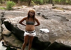 Sexy redhead ladyboy Mo plays with her hair prick outdoors