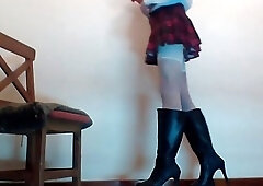 Crossdresser Secretary in office uniform and boots