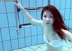 Roxalana swims like a fish with her cock-squeezing beaver