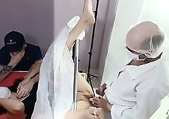 Husband, wife for exam and doctor is excited