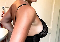 Busty babe playing with her big boobs