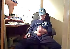 Dressed Dude Sitting & Jacking Off