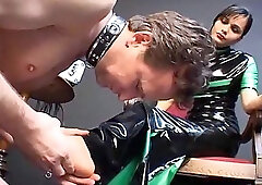 Brunette in Latex Dominating Slave