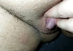 The tip of my clitdick is showing between my pussylips. I rub it and it becomes semierect.