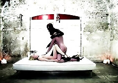 2 latex mistresses use their thrall however they wish. The put her on a sybian and whip her butt until that babe cums.