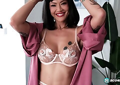 Asian MILF Kitty, 42, fingers her mature pussy
