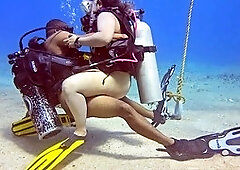 Outdoor amateur interracial fun with a thong bikini by a dive mooring