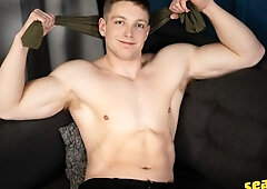 Tall dude Kyle Denton massaging his massive cock here