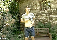 Joshua Czech playing with his meet outside, kneeling