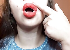 Natural lips with red lipstick smokin' a cigarette in close up