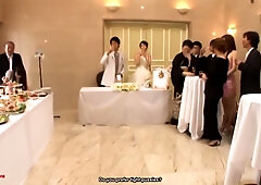 Slender Japanese brunette shares a passionate moment at the wedding reception