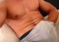 Strong guy shows his huge cock and cums