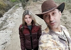 Gina Gerson and a brunette share intimate moments with a tattooed man in the autumn woods