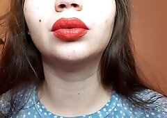 Natural lips with red lipstick smokin' a cigarette in close up